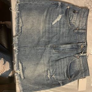 I am selling a skirt, Brand is KanCan, Size is Medium, Color is light wash.